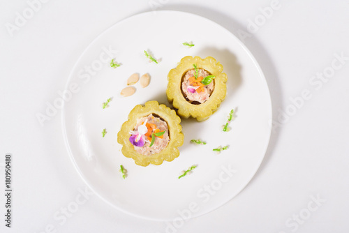 Boiled bitter gourd with pork decorated with carrot and flower,food styling.Top view of food