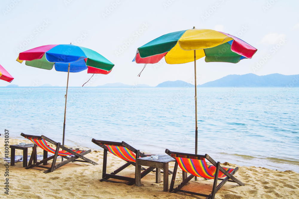 colorful umbrellas and deck chairs on the beach