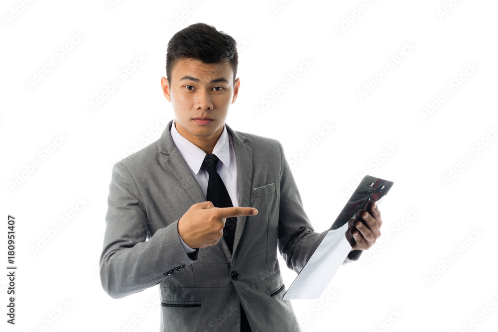 Portrait of a young business man reading annual report. Isolated on white background Portrait of a young business man reading annual report. Isolated on white background