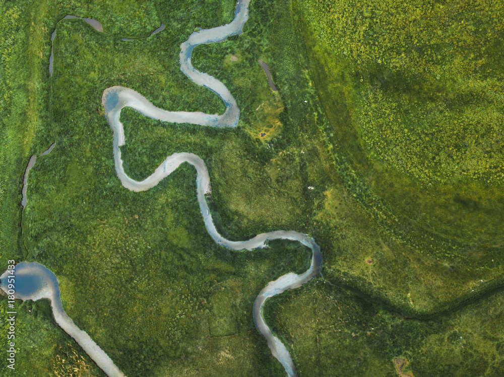 aerial landscape of winding river in green field, top view of beautiful nature texture from drone aerial landscape of winding river in green field, top view of beautiful nature texture from drone