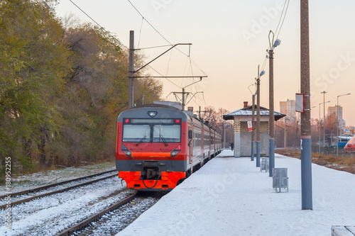 Electric train awaits passengers on the platform