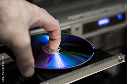 DVD disc inserting to player photo