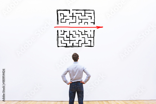 problem and solution concept, business man thinking about exit from complex labyrinth photo