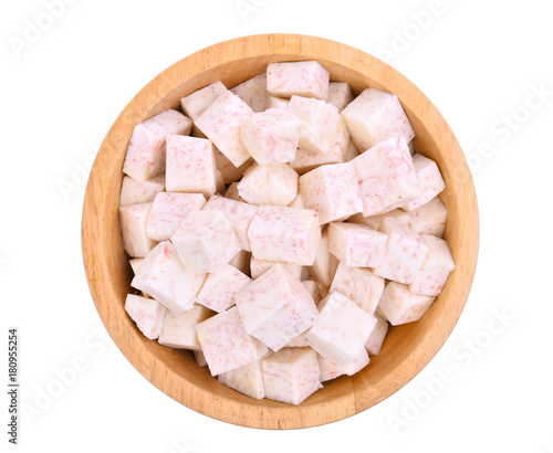 top view, cube of taro root in wooden bowl isolated on white background photo