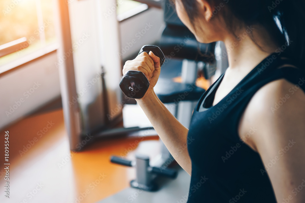 Asian woman exercising in the gym, Young woman workout in fitness for her healthy and office girl lifestyle. Asian woman exercising in the gym, Young woman workout in fitness for her healthy and office girl lifestyle.