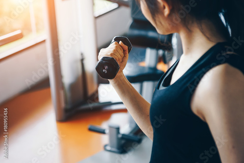 Asian woman exercising in the gym, Young woman workout in fitness for her healthy and office girl lifestyle.