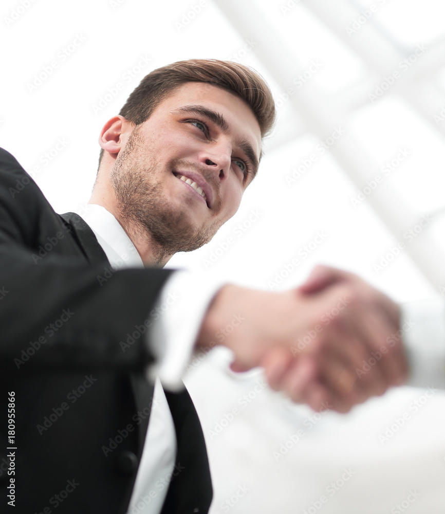 closeup handshake proven business partners