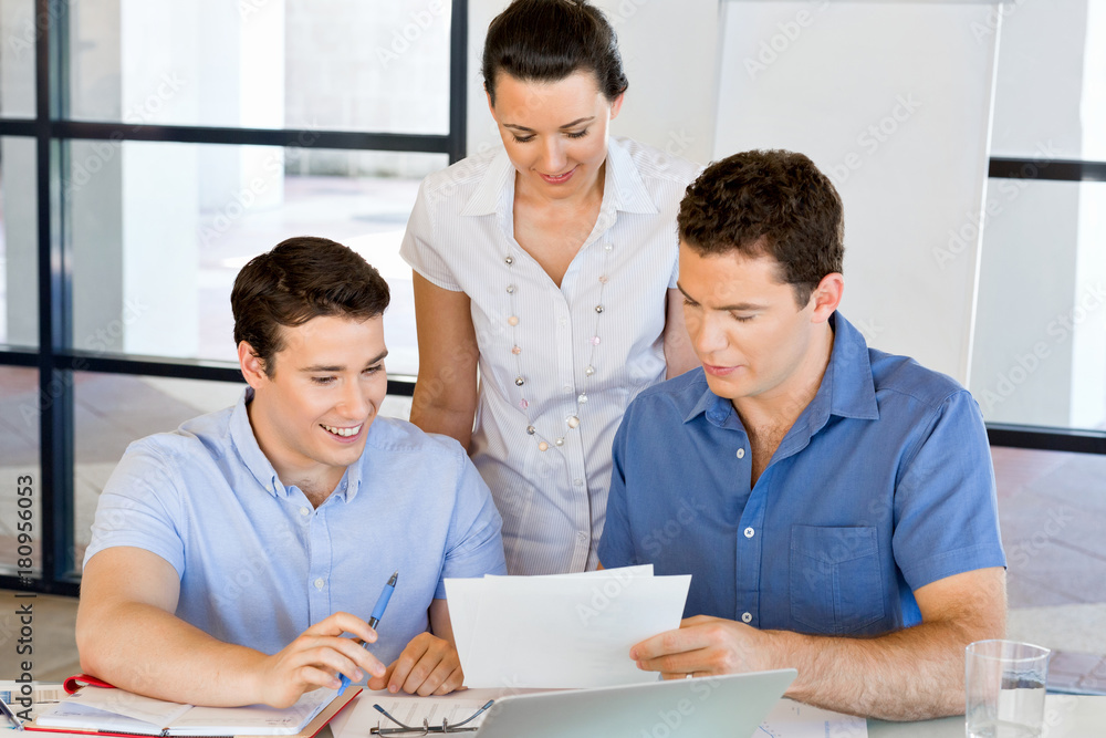 Group of happy young business people in a meeting Group of happy young business people in a meeting