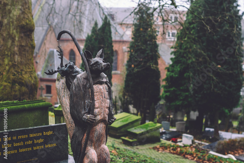 December, 29th, 2016 - Ghent, East Flanders, Belgium. Animal cemetery statue and tomb stone on Campo Santo historical old graveyard in Sint-amandsberg municipality, Gent. photo