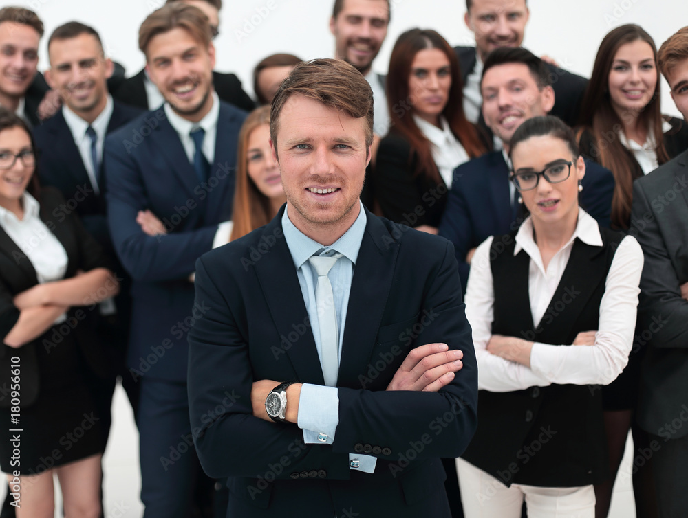 happy businessman standing on background of her business team. happy businessman standing on background of her business team.