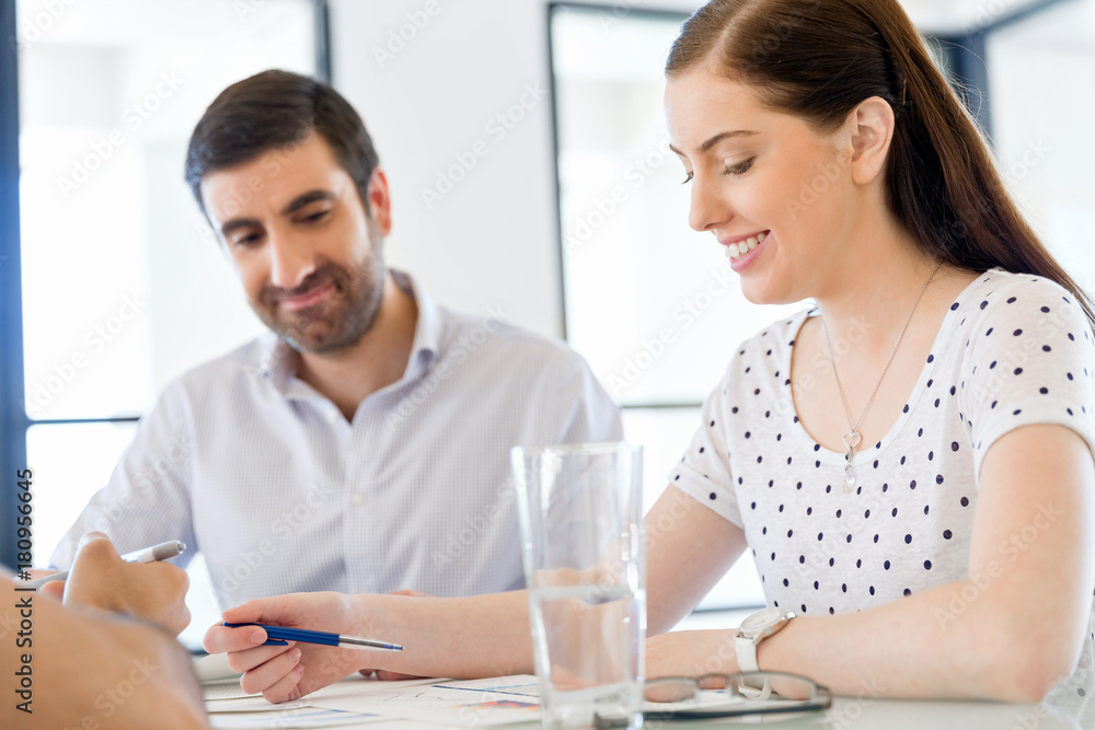Image of two young business people in office Image of two young business people in office