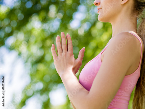 Young woman doing yoga in the park