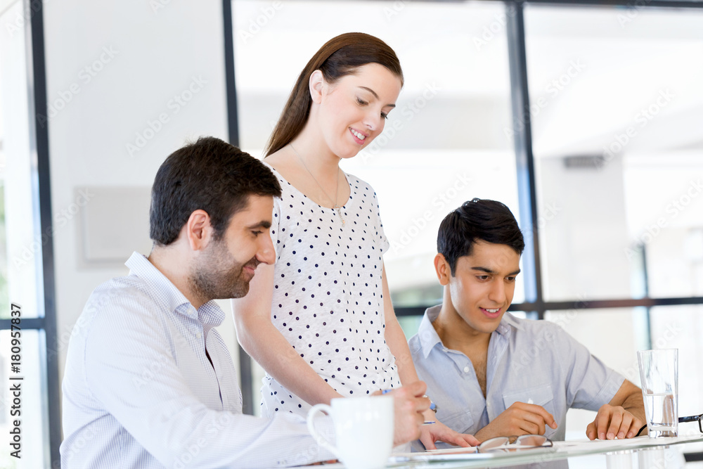 Group of happy young business people in a meeting Group of happy young business people in a meeting