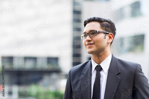 Young asian businessman outdoors