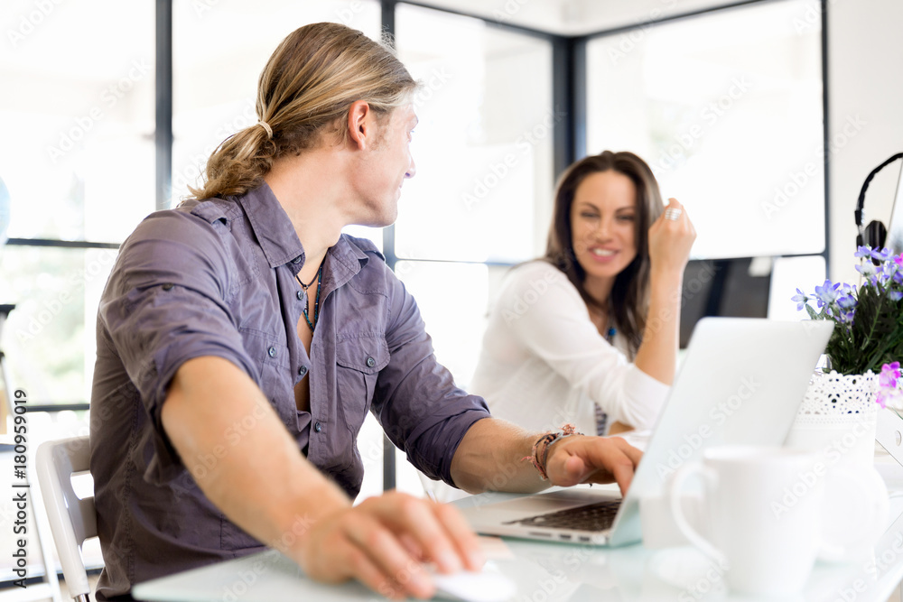 Image of two young business people in office Image of two young business people in office
