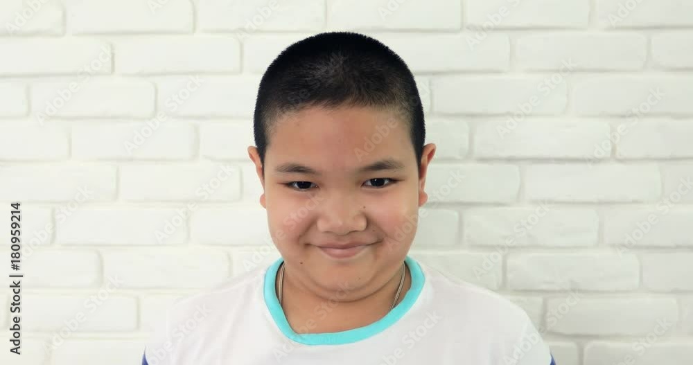 Portrait of young asian child with acting smile angry on your face. Portrait of young asian child with acting smile angry on your face.
