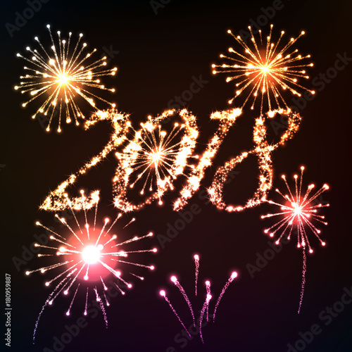 2018 New year background. Light writing shiny letters with fireworks.