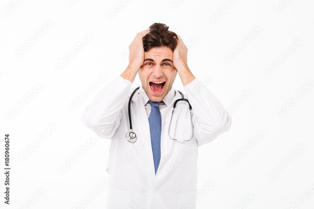 Portrait of a furious mad male doctor with stethoscope Portrait of a furious mad male doctor with stethoscope