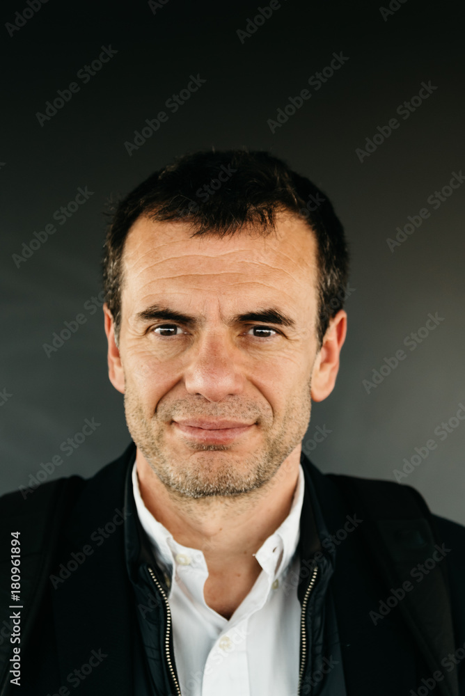 Portrait of middle-aged unshaved man smiling Portrait of middle-aged unshaved man smiling