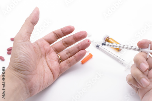 Bleeding medical personnel finger from needle stick injury accident.