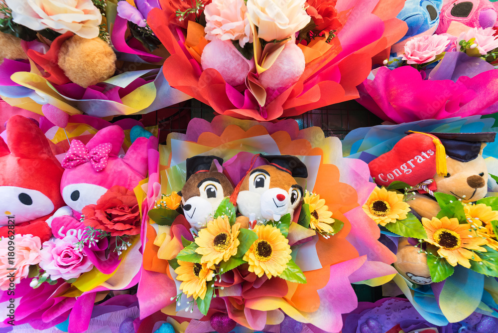 bunches of cute soft toys with flowers