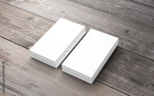 Blank business cards on old wooden desk.