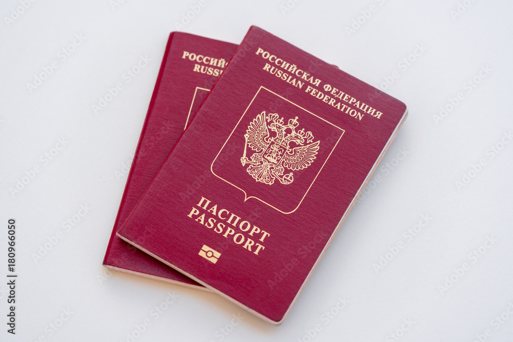 Two red Russian passports on a white background. Isolated Two red Russian passports on a white background. Isolated