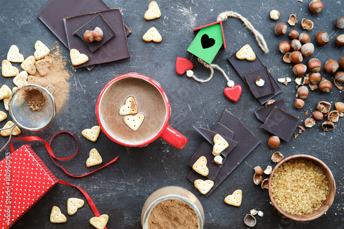  Valentine's Day concept photo. Heart Cookies in mug with milk chocolate. Top view