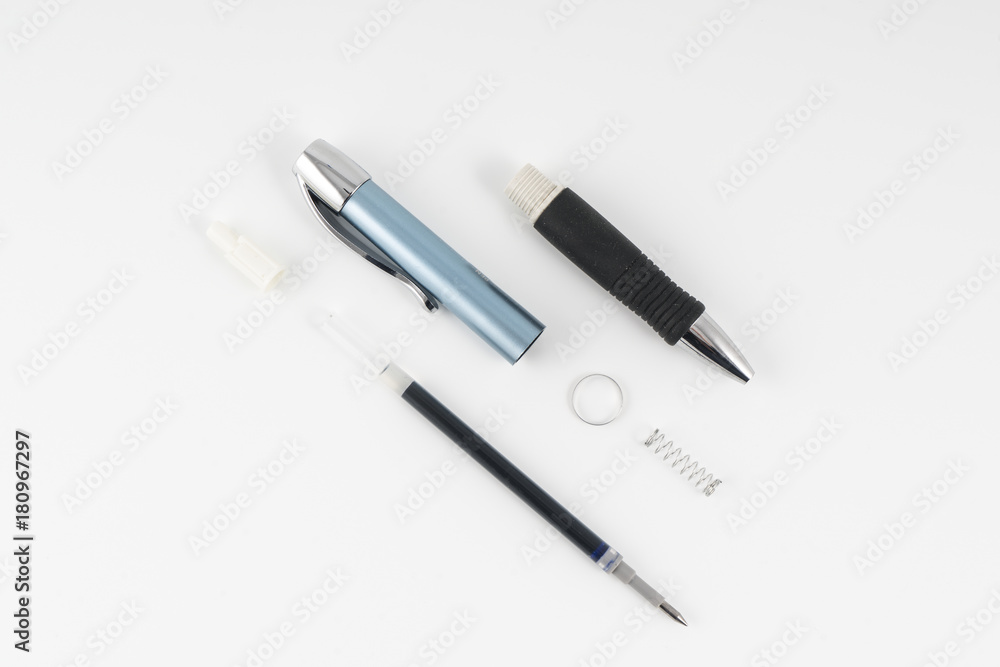 share a ballpoint pen disassembled on a white background