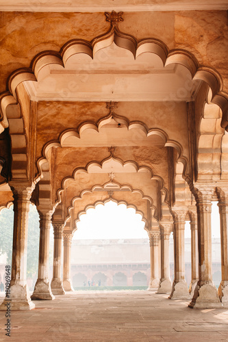 Row of columns and arches in Agra, India. Old beautiful Indian architecture