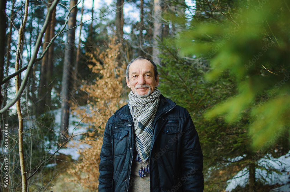 The spring portrait of elderly man with a gray beard