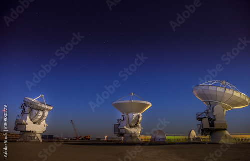 ALMA, base station of the worldwide biggest telescope Array at night, Chile photo