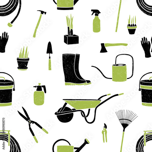 Seamless pattern with black and green gardening tools on white background