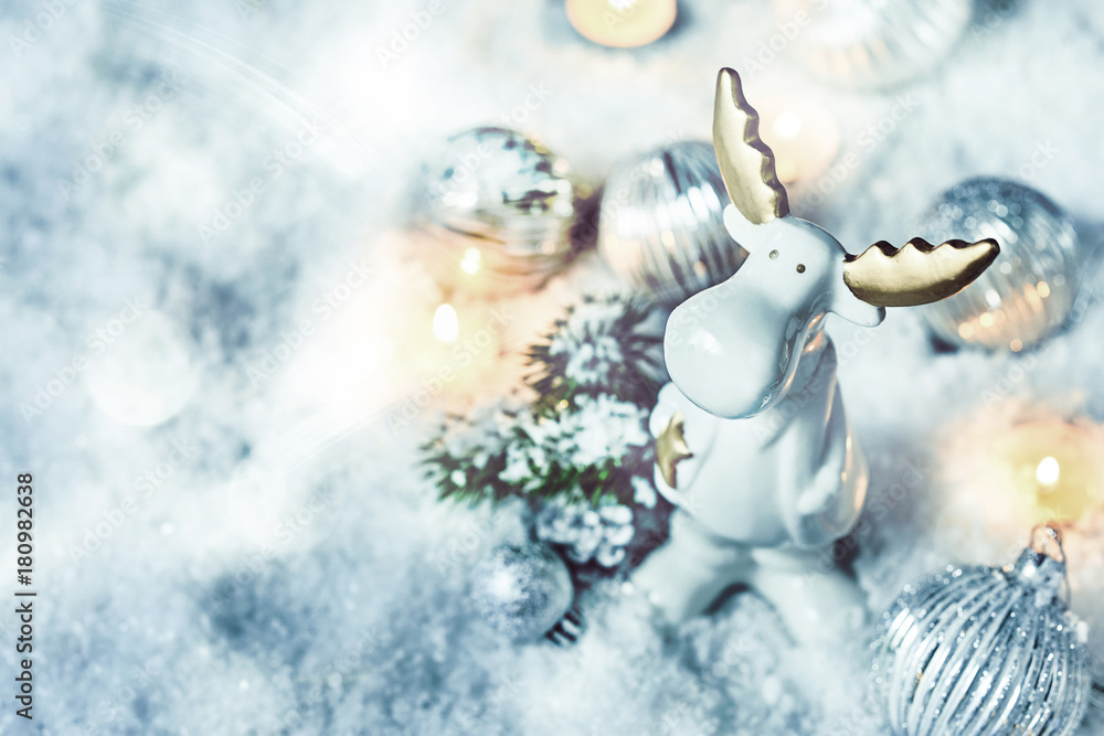 Obraz premium Adorable little white Christmas reindeer in snow