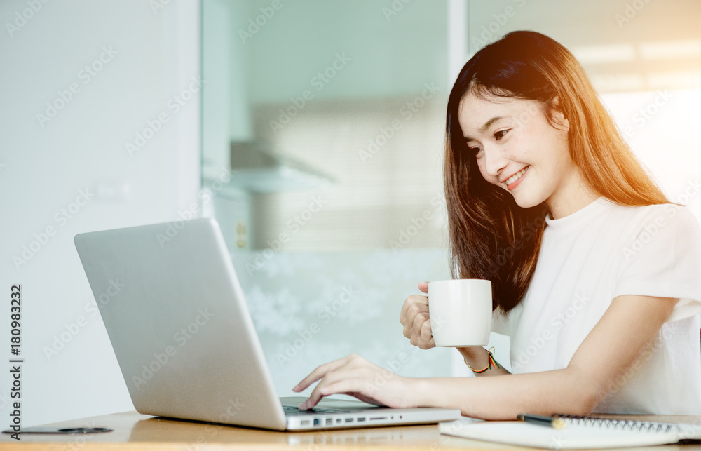Young asian girl is freelancer with her private business at home office, working with laptop, coffee, online marketing, Customer order and packaging or packing. Young asian girl is freelancer with her private business at home office, working with laptop, coffee, online marketing, Customer order and packaging or packing.