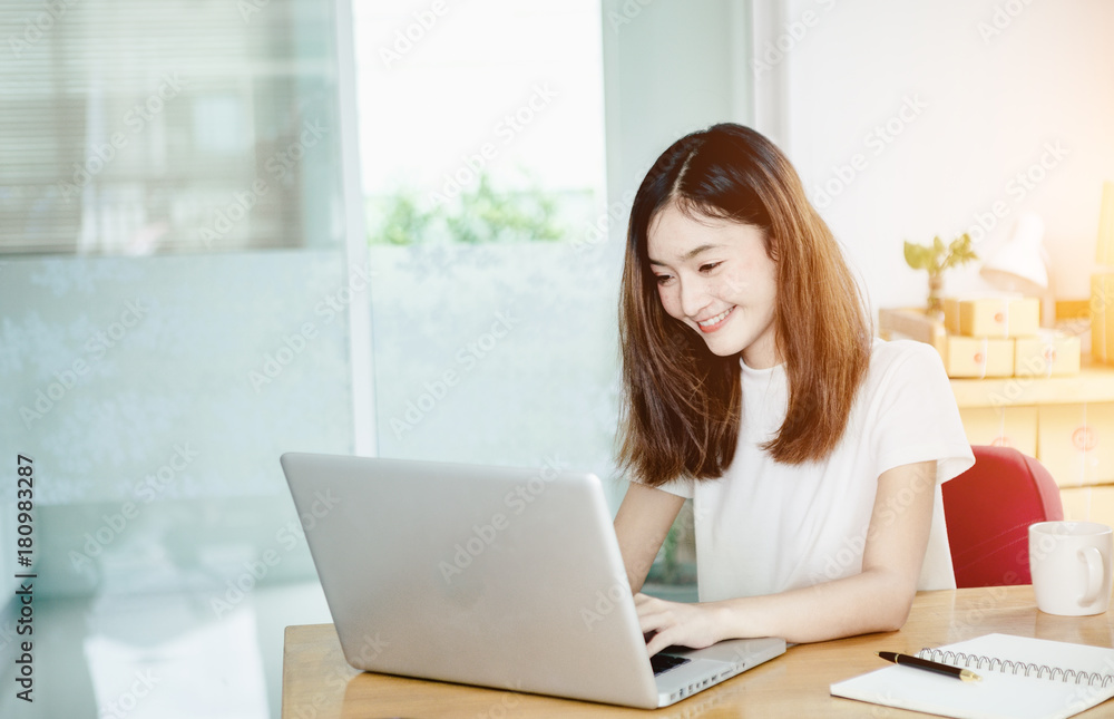 Young asian girl is freelancer with her private business at home office, working with laptop, coffee, online marketing, Customer order and packaging or packing. Young asian girl is freelancer with her private business at home office, working with laptop, coffee, online marketing, Customer order and packaging or packing.