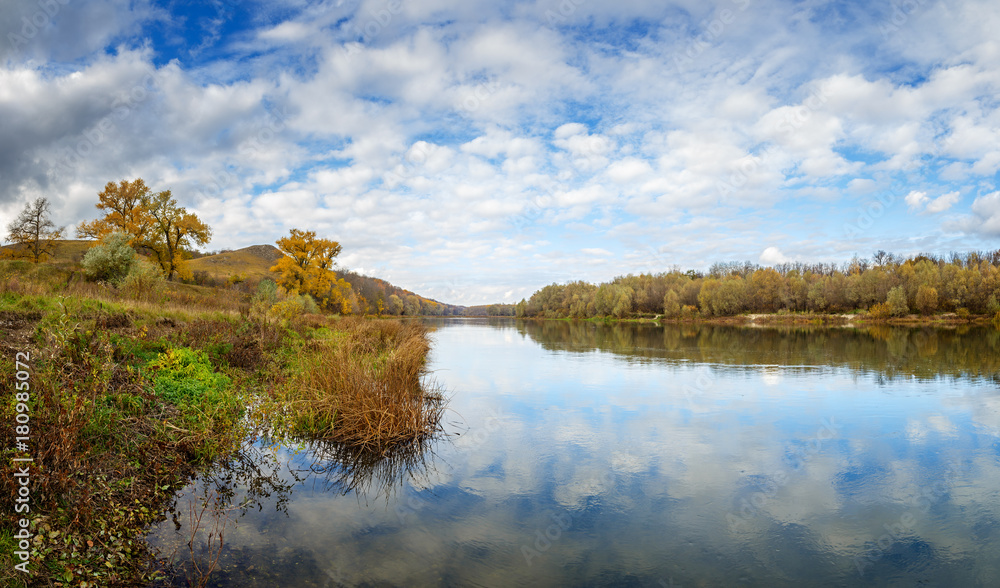 Autumn landscape in central Russia. View of the Dons River by the reflection of the cloudy sky.