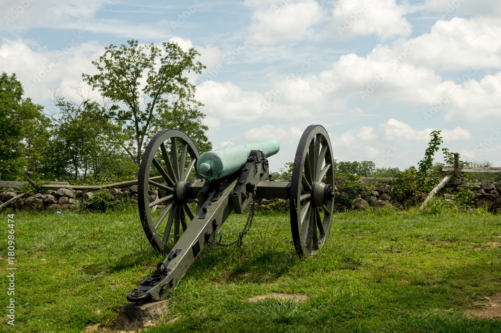 Historic Cannon Artillery Pointing over Stone Wall