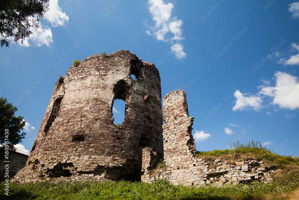 Summer view to castle ruins in Buchach with beautiful sky and clouds, Ternopil region, Ukraine