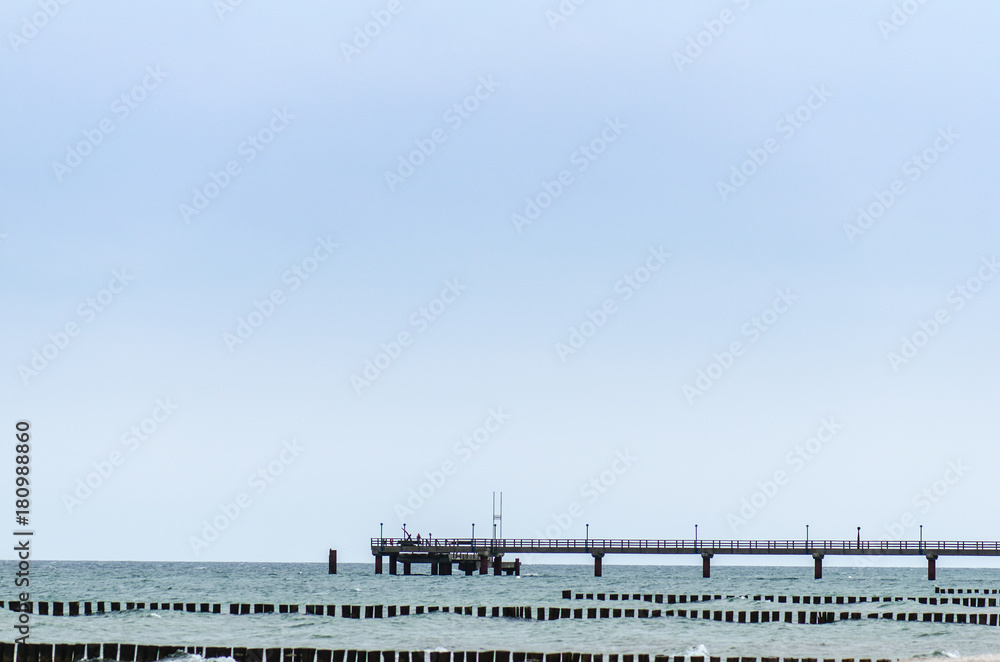 sea with wooden pier
