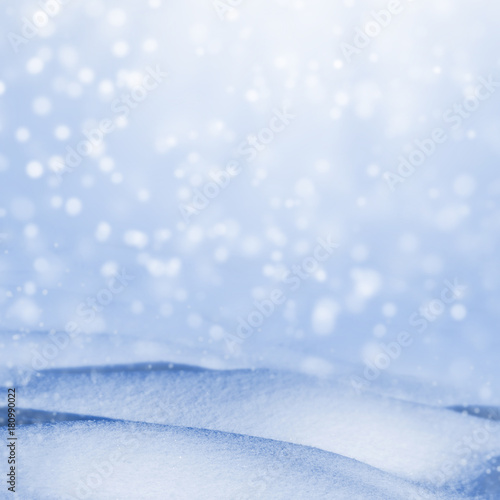 Winter christmas background with deep snowdrifts and falling snow