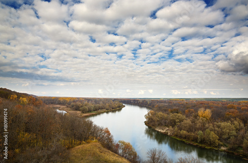 Autumn landscape on the hills of the River Don. View of the pond on a background of cloudy sky ..