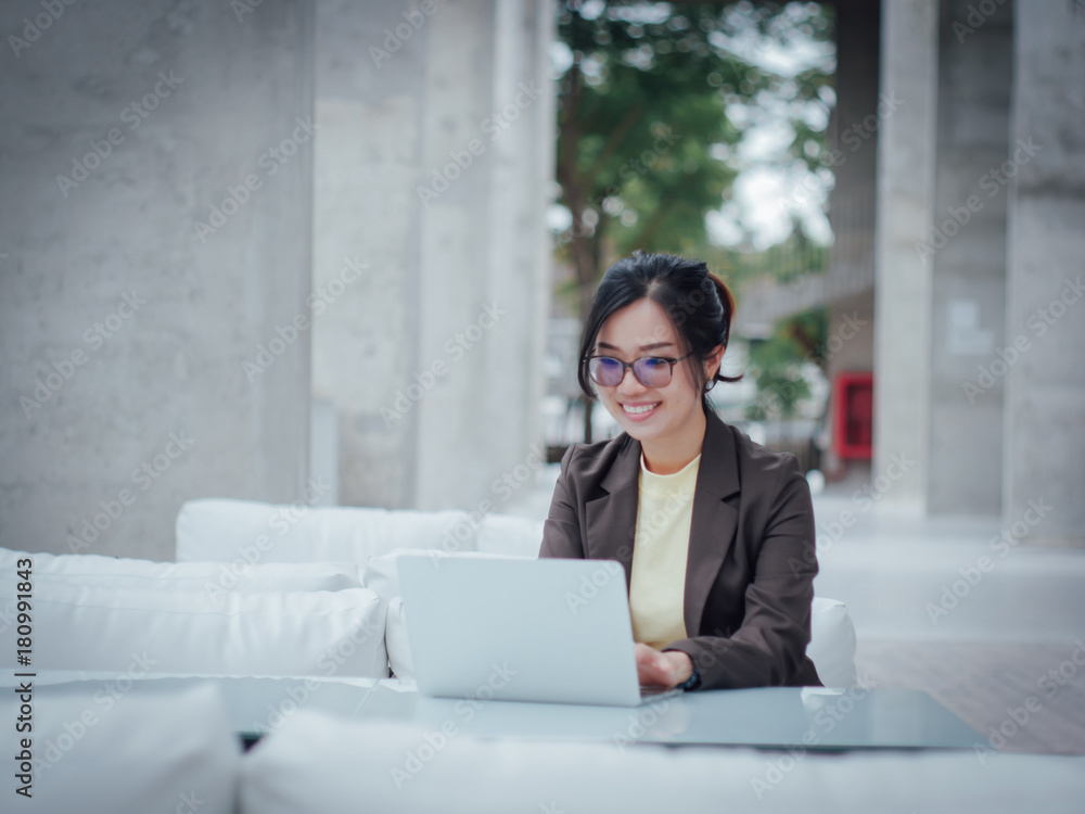 Asian business woman with laptop happy and smile concept success work Asian business woman with laptop happy and smile concept success work