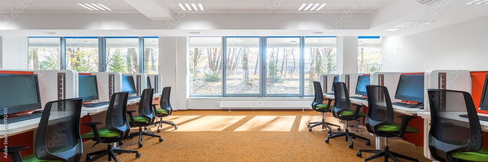 Fototapeta premium Spacious IT classroom with window