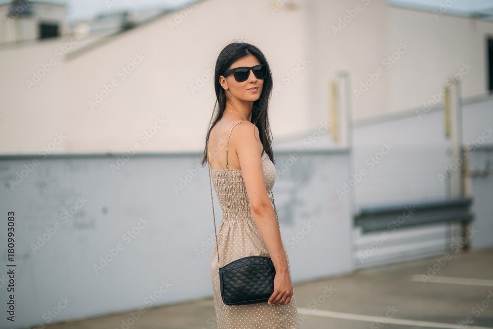 Fototapeta premium Brunette and blonde are photographed and enjoy life. Sunny day. Summer.
