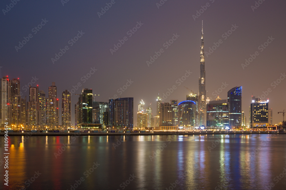 DUBAI, UAE - MARCH 23, 2017: The evening panorama over the new Canal with the Downtown and Burj Khalifa tower.