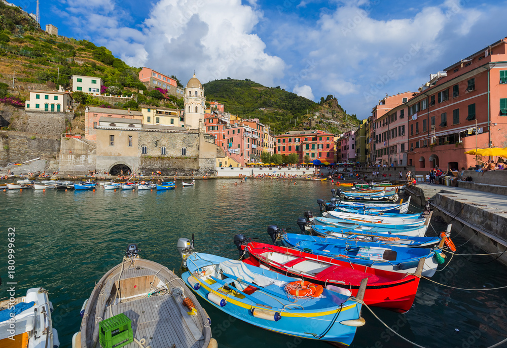 VERNAZZA, ITALY - AUGUST 17, 2016: Tourists walk by Vernazza in Cinque Terre on August 17, 2016 in Vernazza Italy