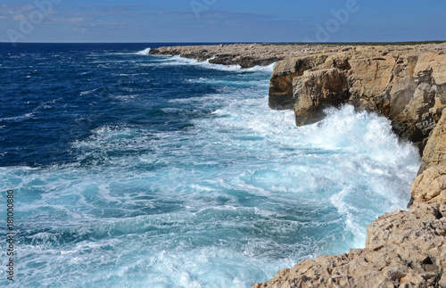 Waves breaking on the rocks of Cape Lara Paphos Cyprus photo