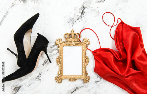 Fashion flat lay Red dress black high heels golden frame