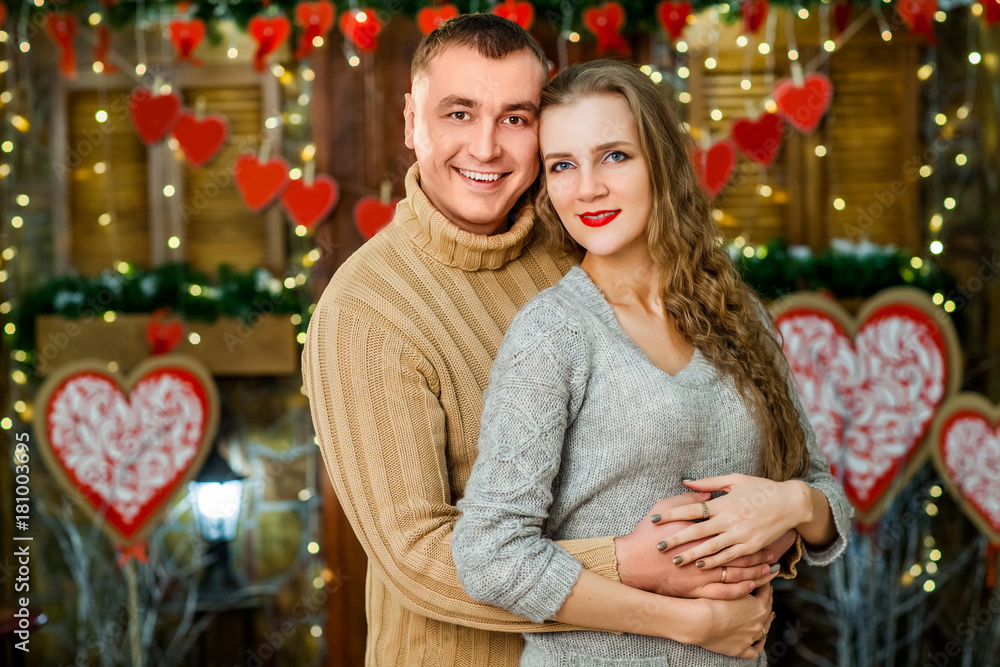 husband and wife celebrate valentine's day. they hugging and smiling. Concept of happy valentine's day husband and wife celebrate valentine's day. they hugging and smiling. Concept of happy valentine's day